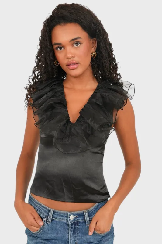 "Glow" top black sold by Meet Me There