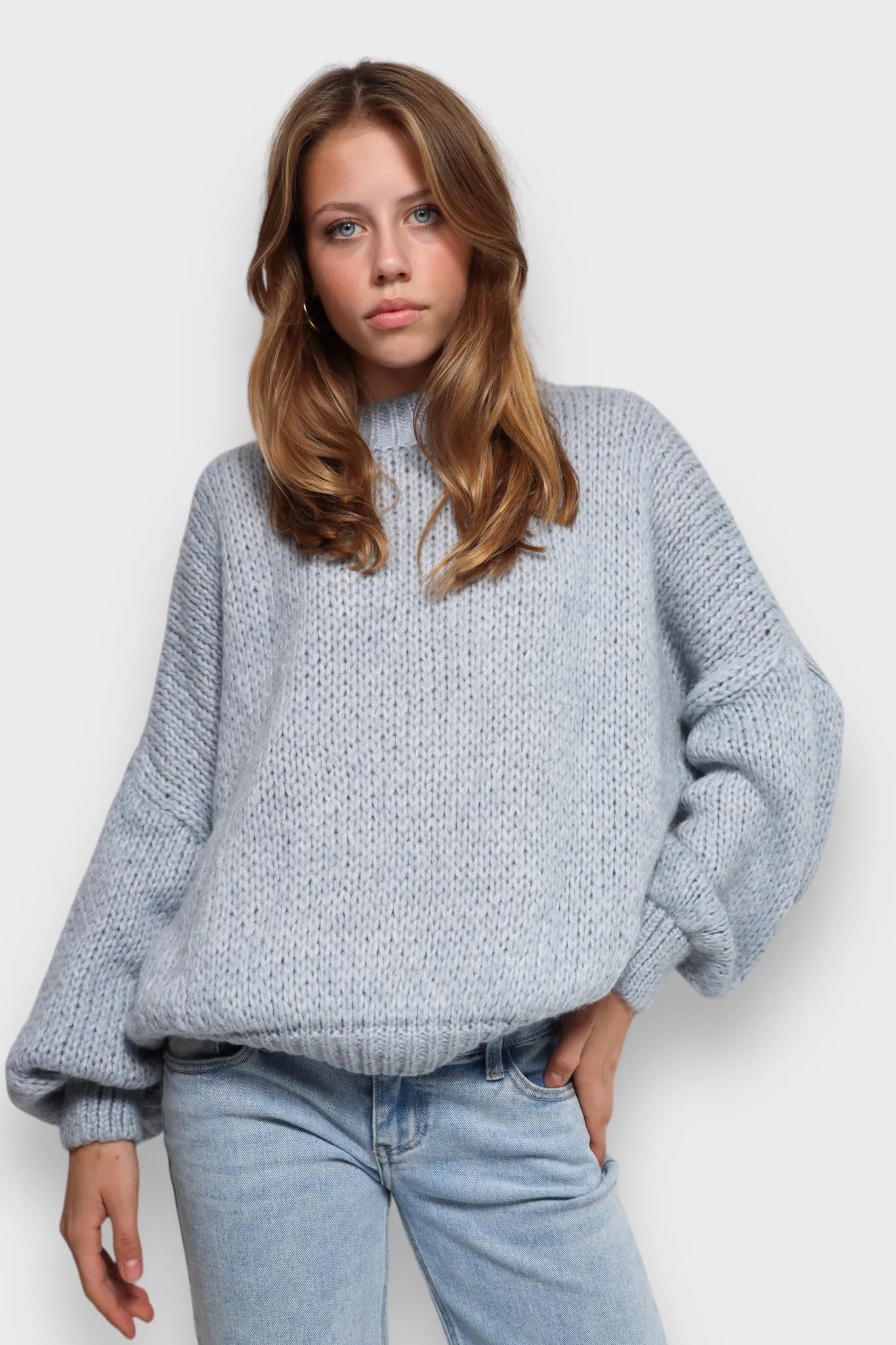 "Keep me warm" sweater light blue sold by Meet Me There