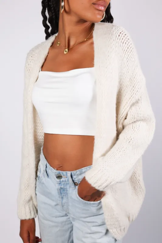 “Keep me warm" vest beige sold by Meet Me There