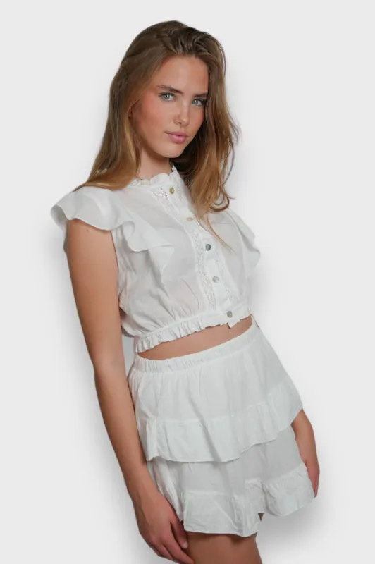 "Joy" skort white sold by Meet Me There
