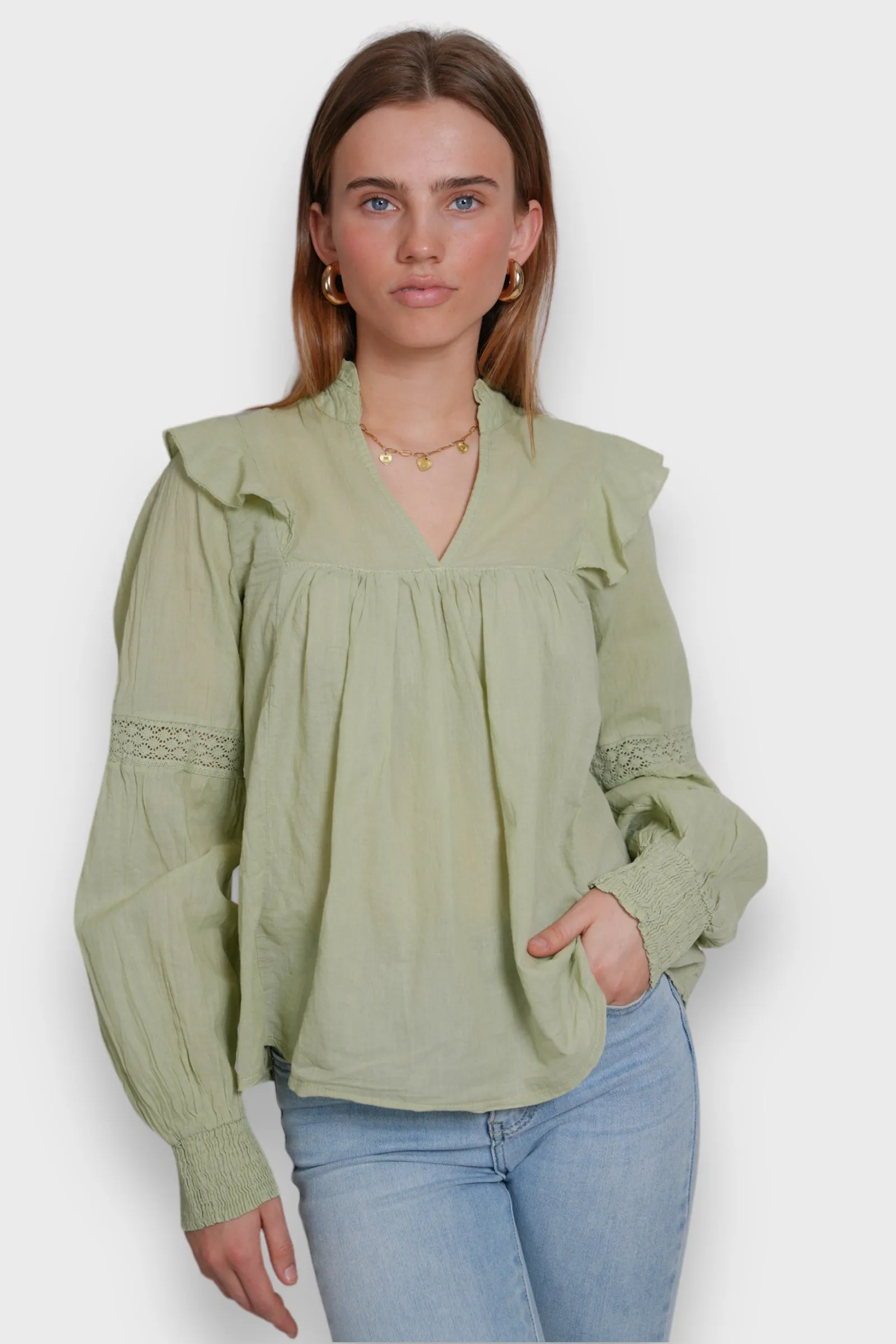"Glory" blouse sage green sold by Meet Me There
