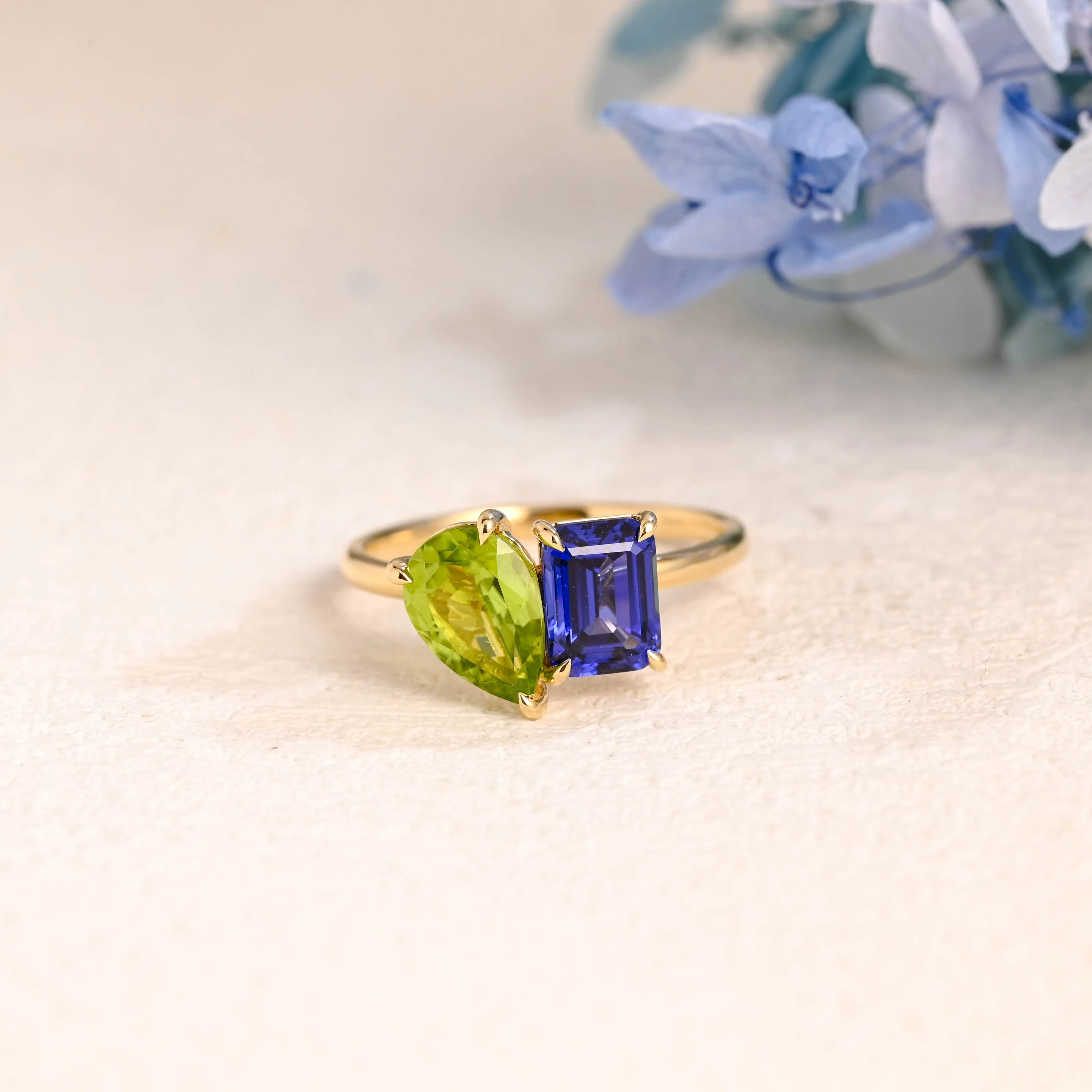 Solid Gold Toi Et Moi Emerald Cut Blue Sapphire & Pear Cut Olivine Engagement Ring sold by Causyou