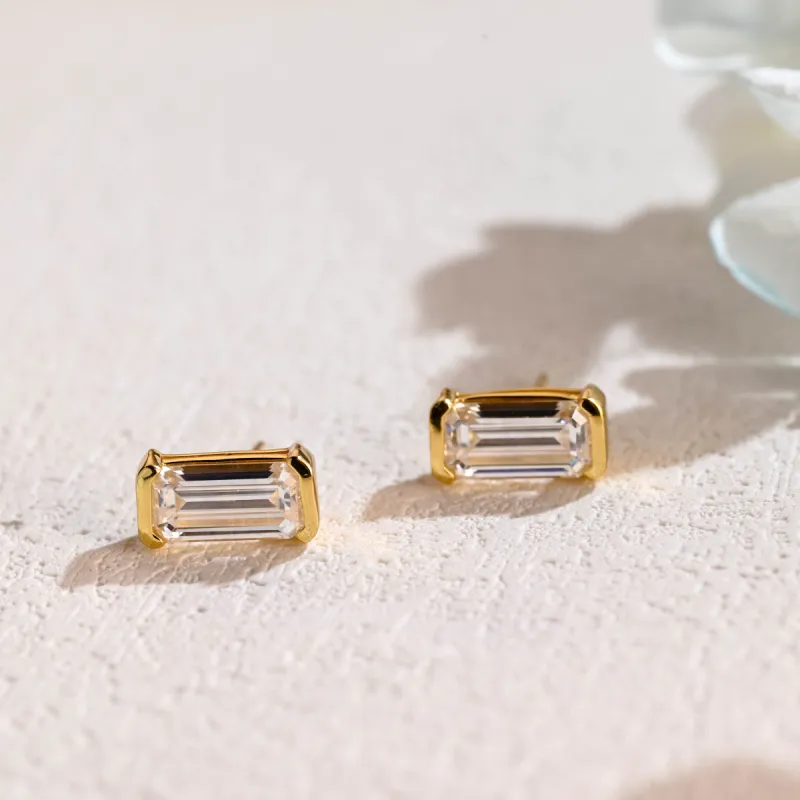 Solid Gold Half Bezel Elongated Emerald Cut Moissanite Earrings sold by Causyou