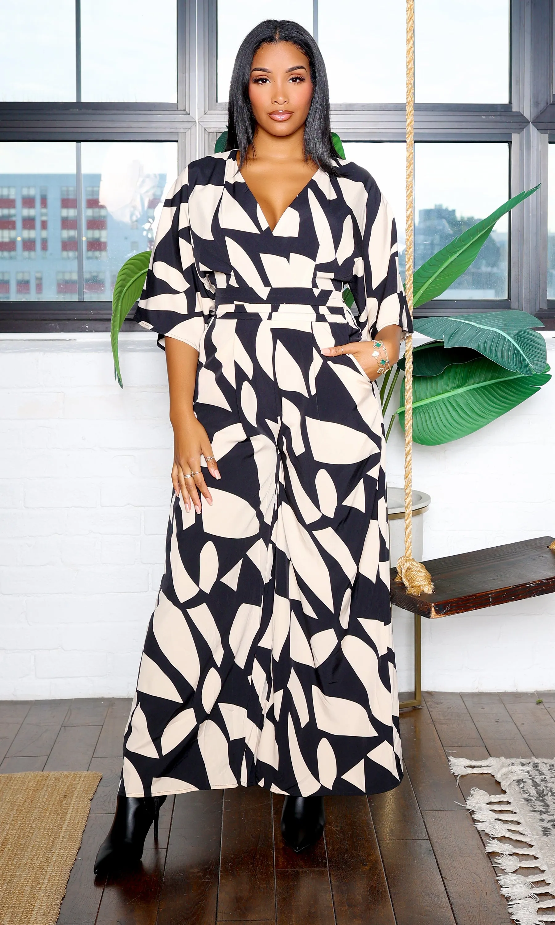 Shey | V-Neck Jumpsuit with Pattern Print sold by Cutely Covered