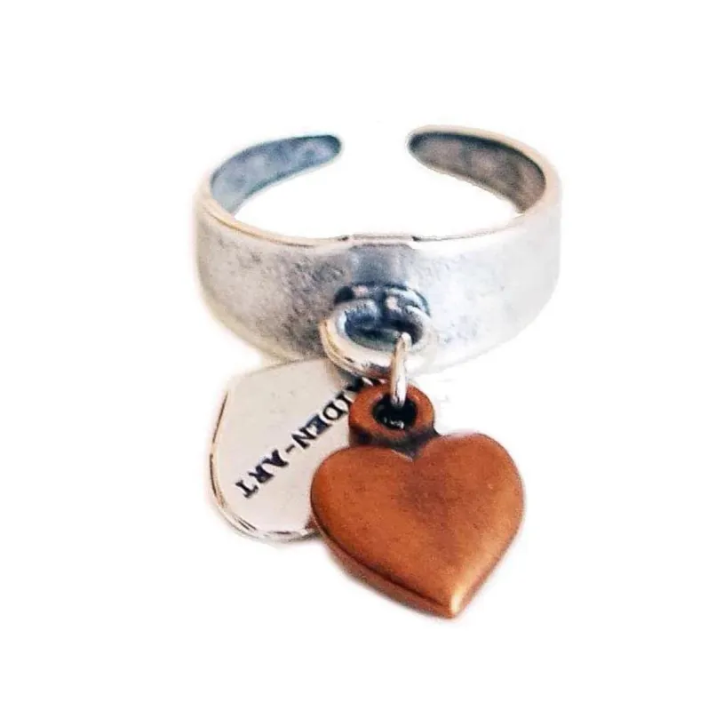 Statement ring in silver with copper heart charm sold by Maiden-Art