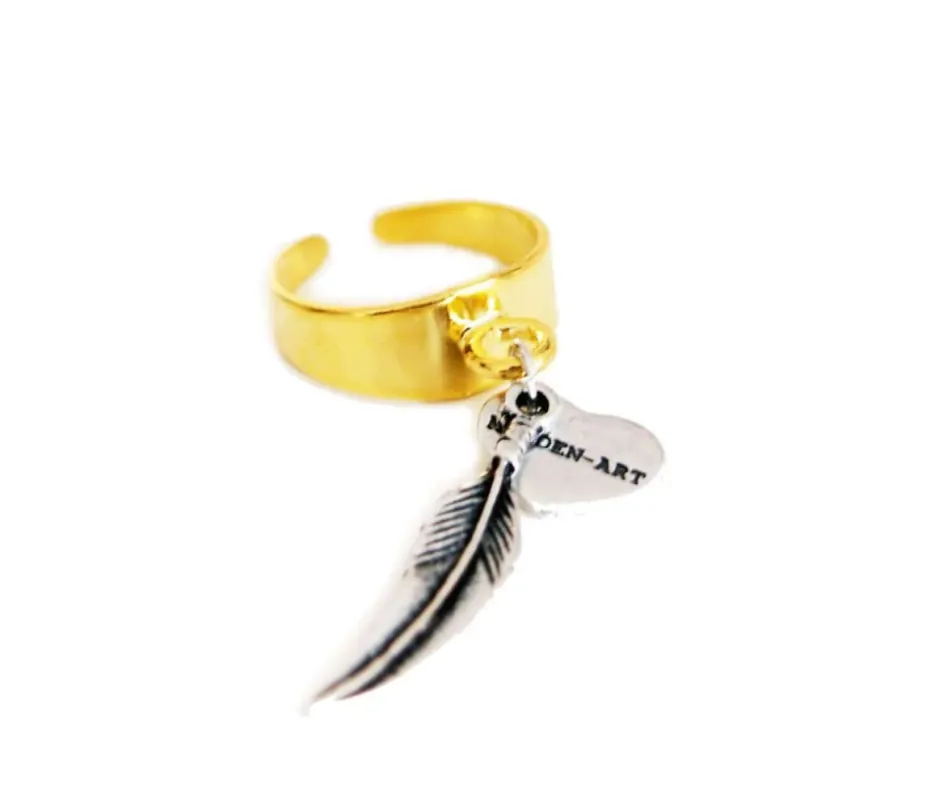 Statement ring in gold with feather charm sold by Maiden-Art