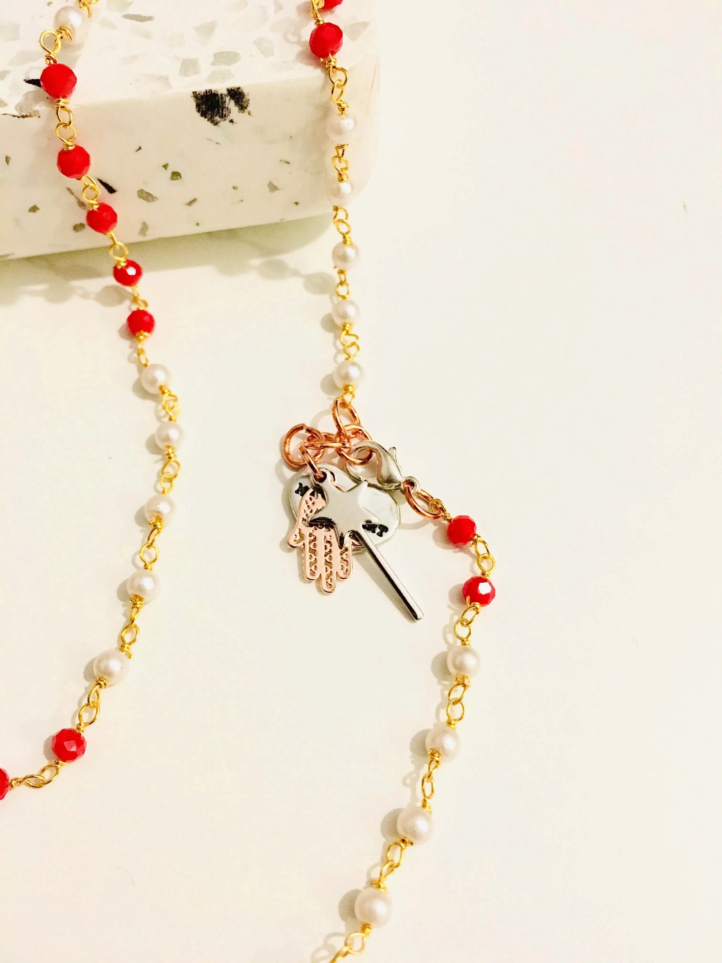Rosary pearls and red crystals long necklace with magic wand and hamsa charms. sold by Maiden-Art product image thumbnail 4