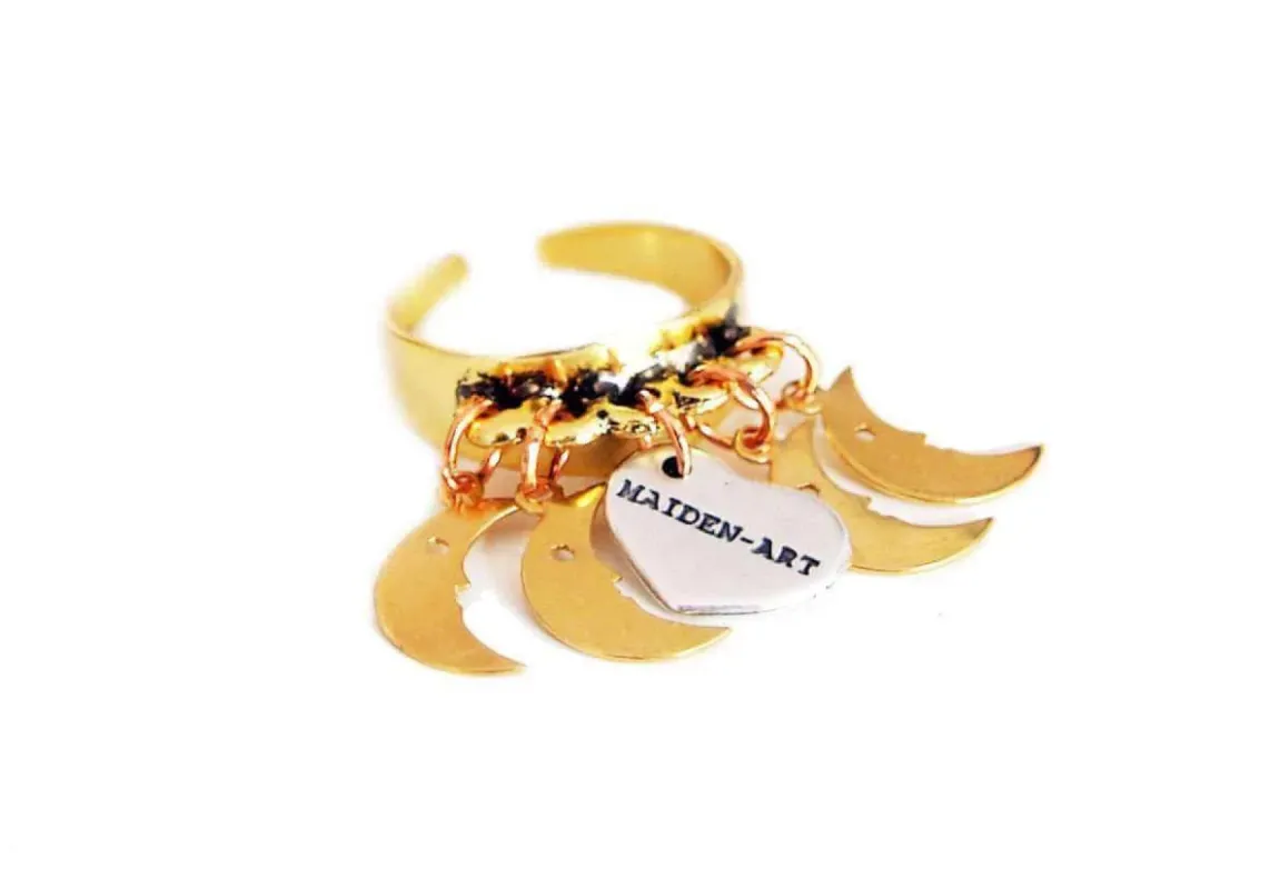 Statement ring in gold with moon charms sold by Maiden-Art