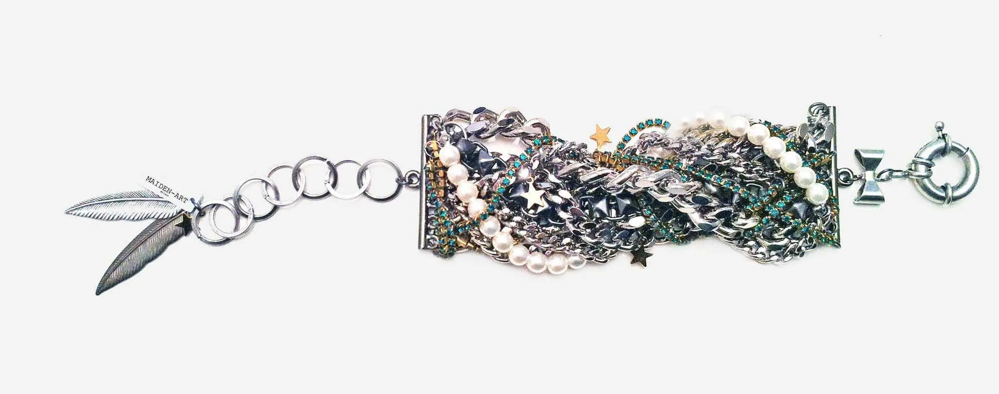 Cuff bracelet with white pearls and emerald green crystals sold by Maiden-Art