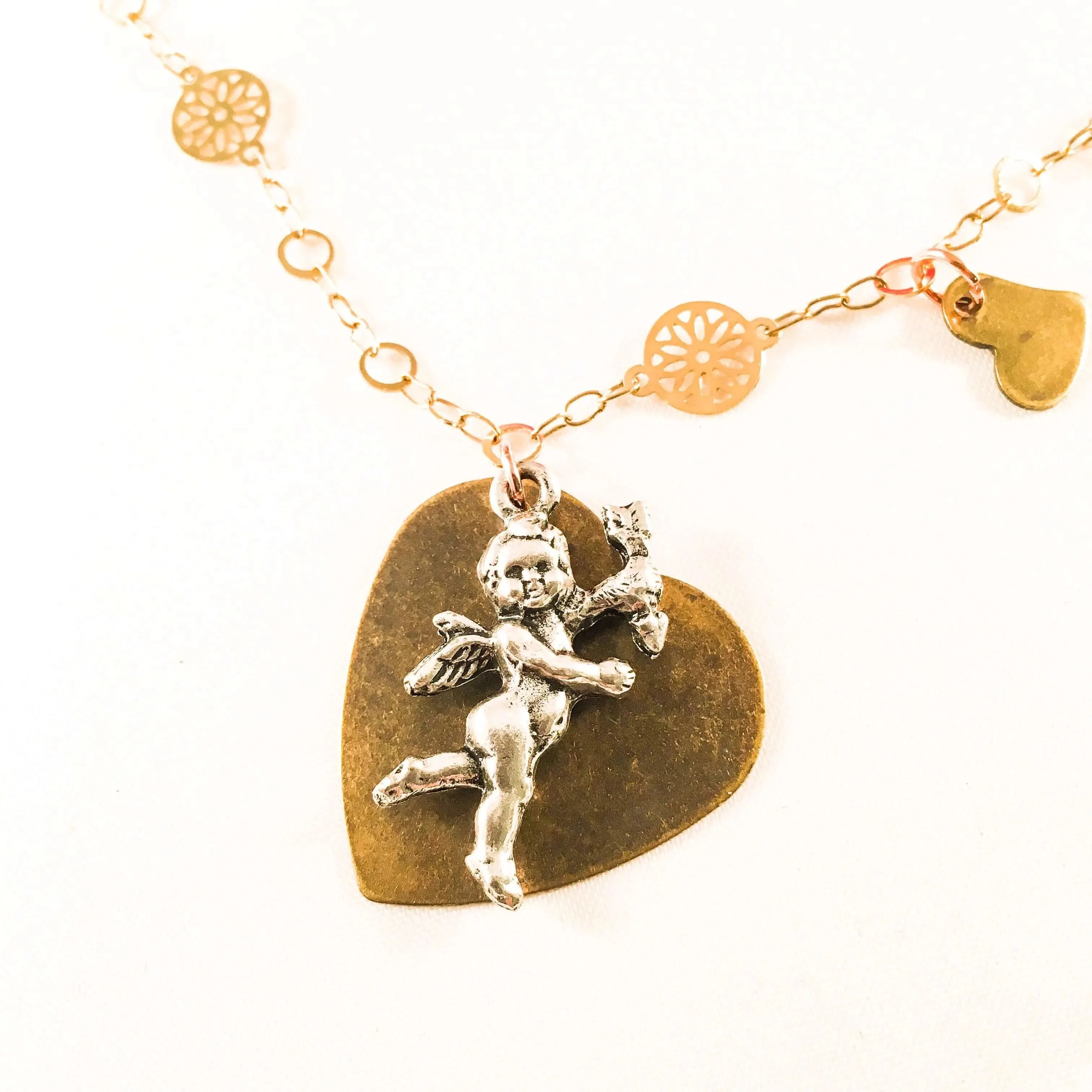 Silver Cherub And Bronze Heart Charm Necklace with 18kt Gold Plated Flower Chain and 3 small hearts charms. sold by Maiden-Art product image thumbnail 2
