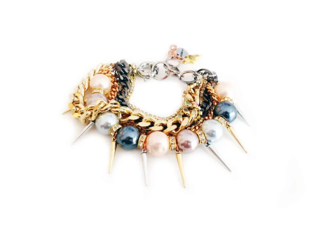 Handmade pearl cuff bracelet and gold chains, rhinestones, gold charms, pointed studs. Trendy jewelry, trendy bracelet. sold by Maiden-Art