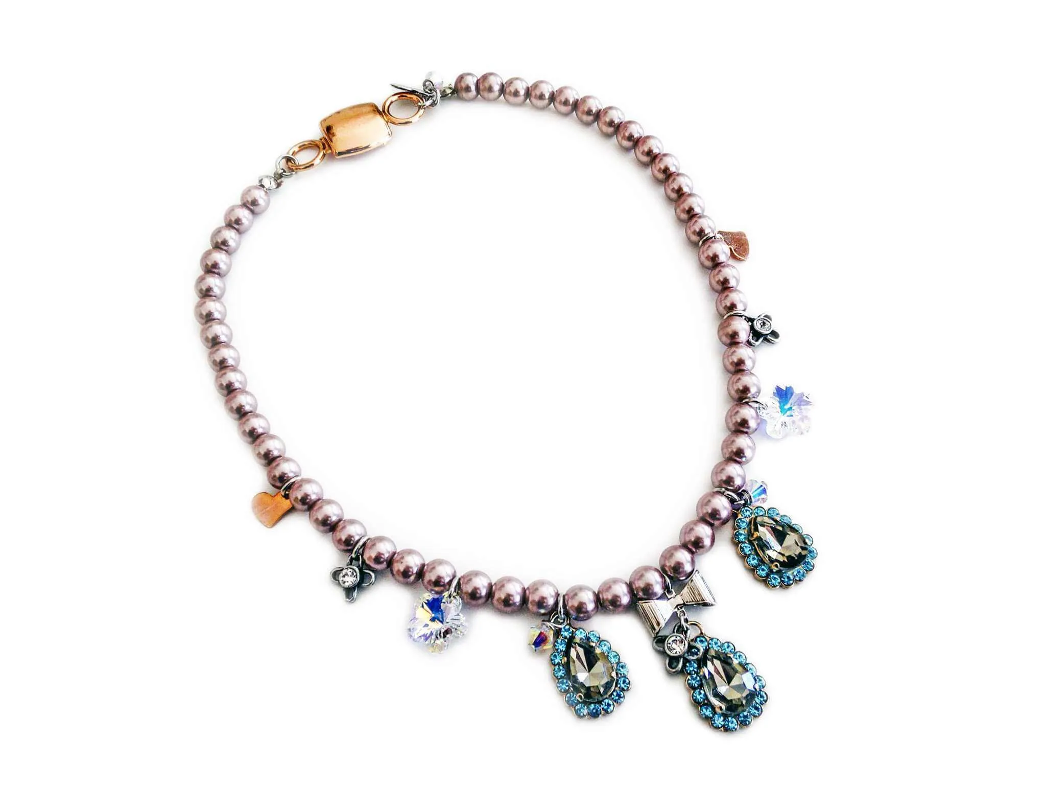 Beaded necklace with light blue rhinestones, silver plated brass and small charms. sold by Maiden-Art