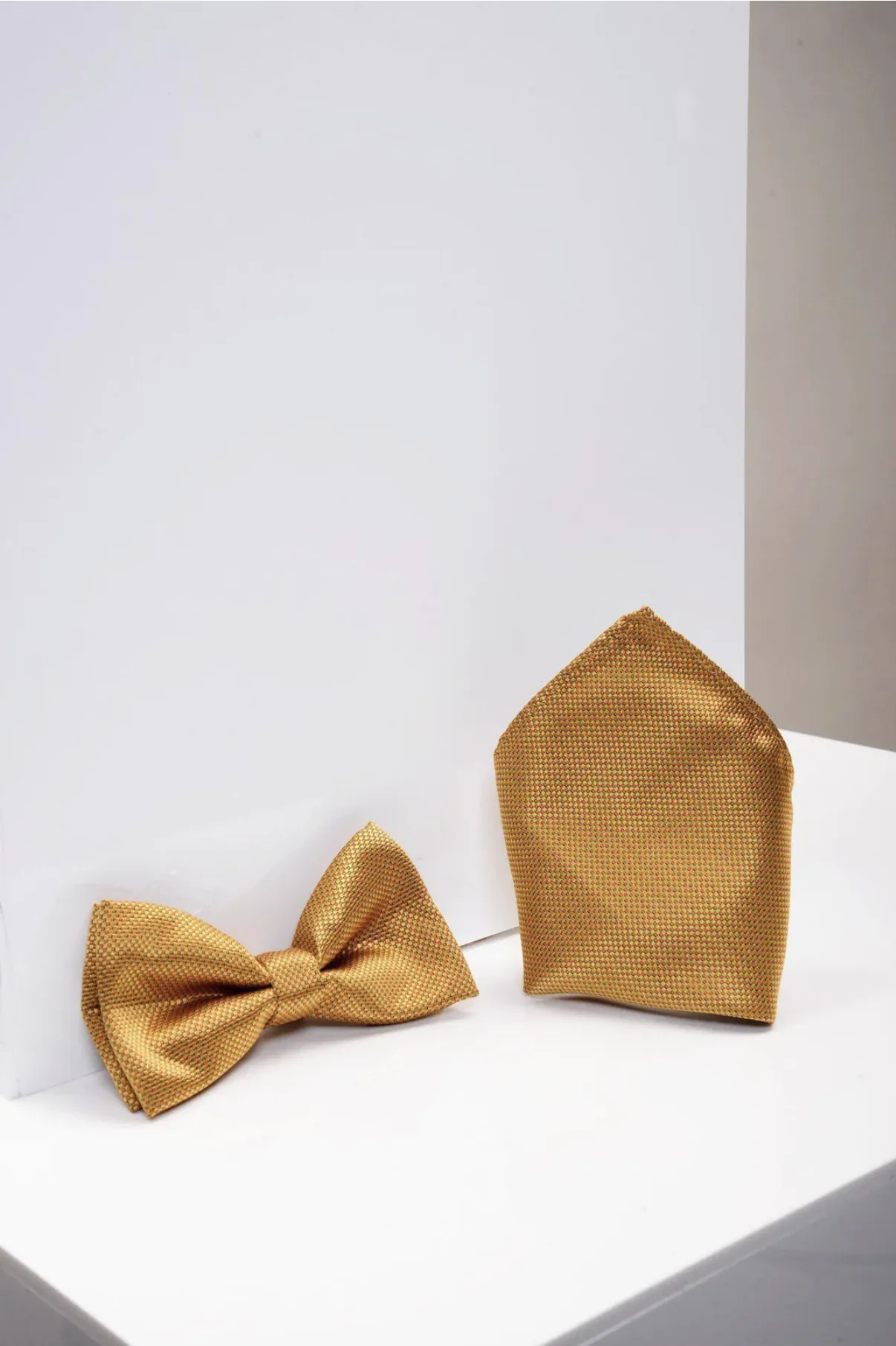 TB17 - Birdseye Print Bow Tie and Pocket Square Set In Gold sold by Marc Darcy