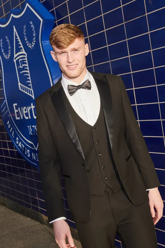 The Everton Collection | Jarrad Branthwaite in DALTON Black Tux Lapel Diamond Suit sold by Marc Darcy