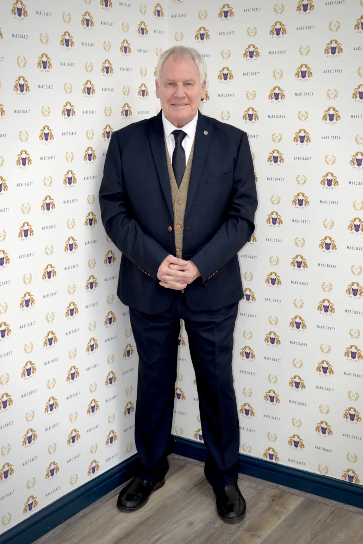 Former Manchester City Manager and Footballer Joe Royle in Max Navy Suit With Ted Waistcoat sold by Marc Darcy