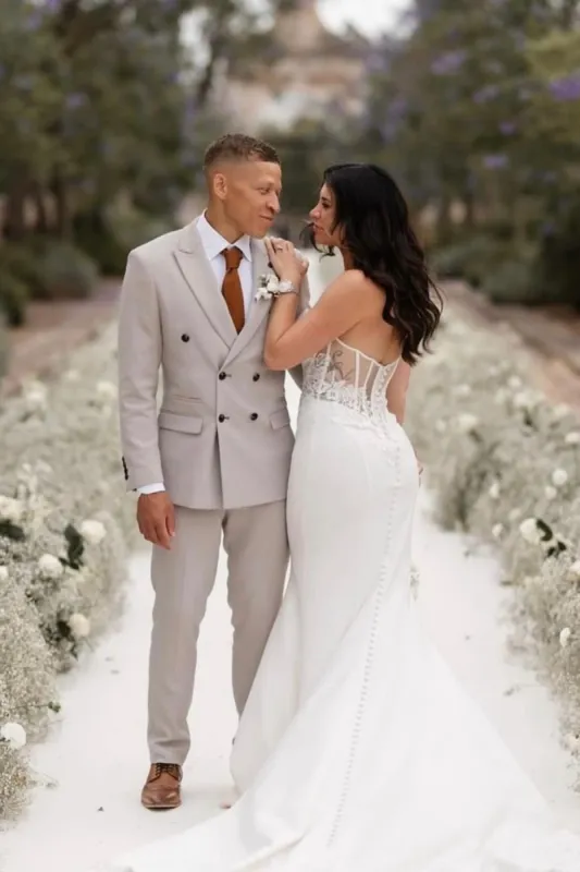 Footballer Dwight Gayle in HM5 Stone Double-Breasted Suit on his wedding day sold by Marc Darcy