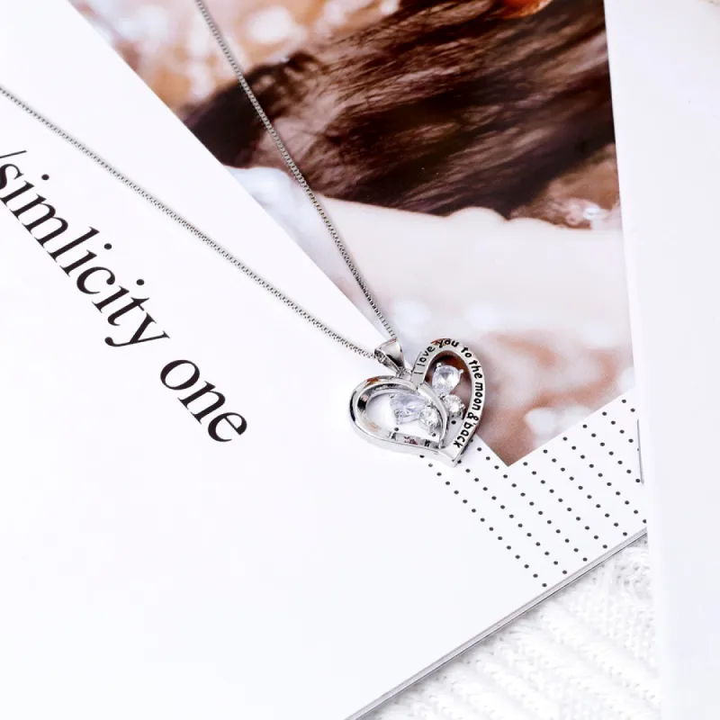 To My Granddaughter "I love you to the moon and back." Heart Necklace sold by SARAH'S WHISPER