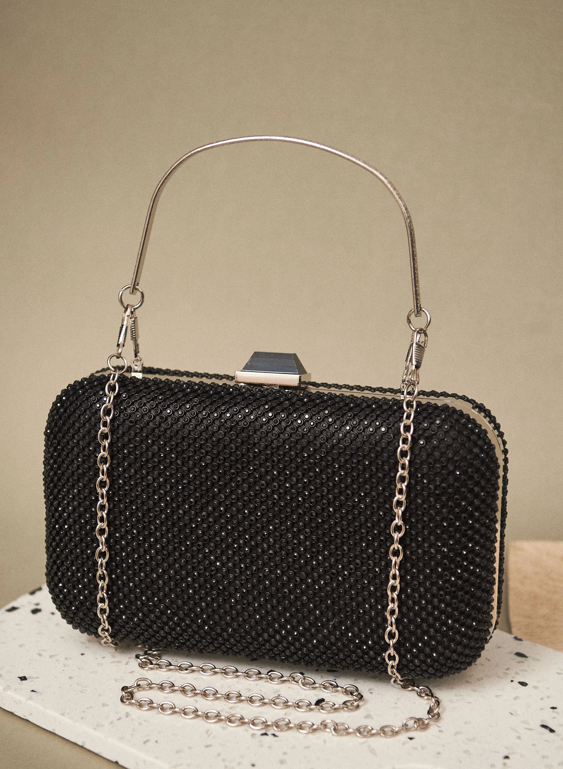 Stone Detail Clutch sold by Melanie Lyne