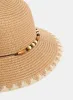 Paper Straw Cloche Hat sold by Melanie Lyne