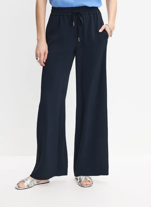 Drawstring Waist Wide-Leg Pants sold by Melanie Lyne