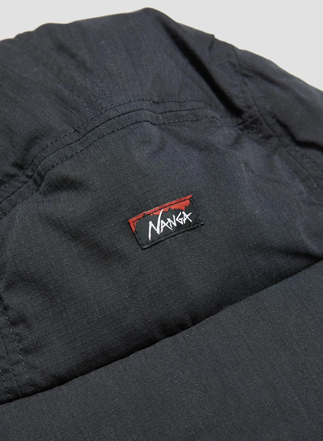 Nanga Hinoc Ripstop Down Ear Flap Cap in Black sold by Nigel Cabourn product image thumbnail 2
