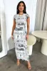 Azira Maxi Dress - Newspaper Print sold by Thats So Fetch