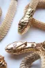 Gold metal chain link snake belt sold by Scott Fraser Collection