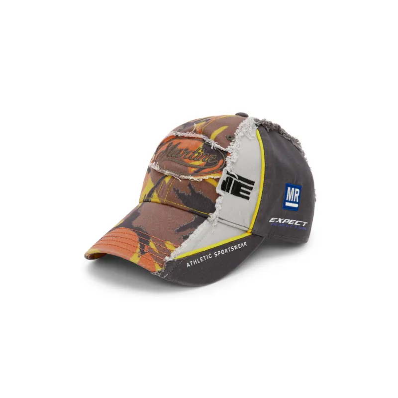 COLLAGE CAP in ORANGE CAMO made by Martine Rose