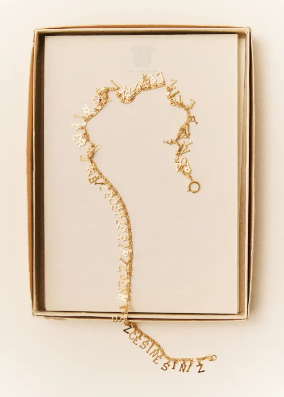 Very Weird Word necklace sold by Bangle Begum