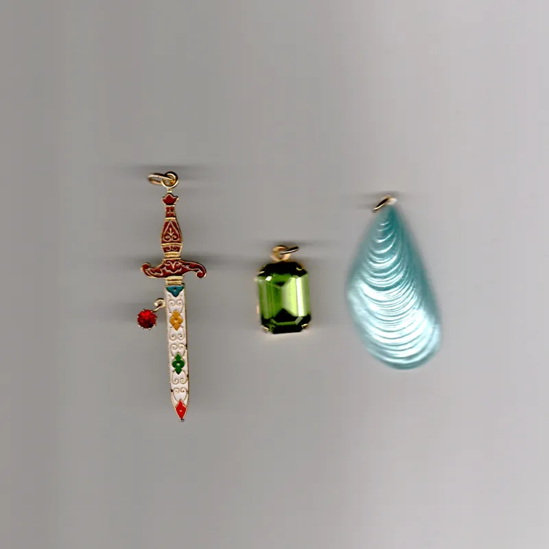 Lovers Charms (Sky mussel + Green strass + Sword) sold by Bangle Begum