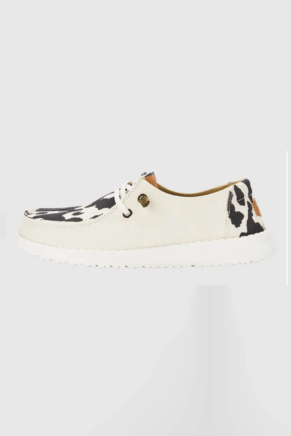 HEYDUDE Women’s Wendy Cow Print Shoes in White/Black | 41037-11G sold by Glik’s product image thumbnail 2