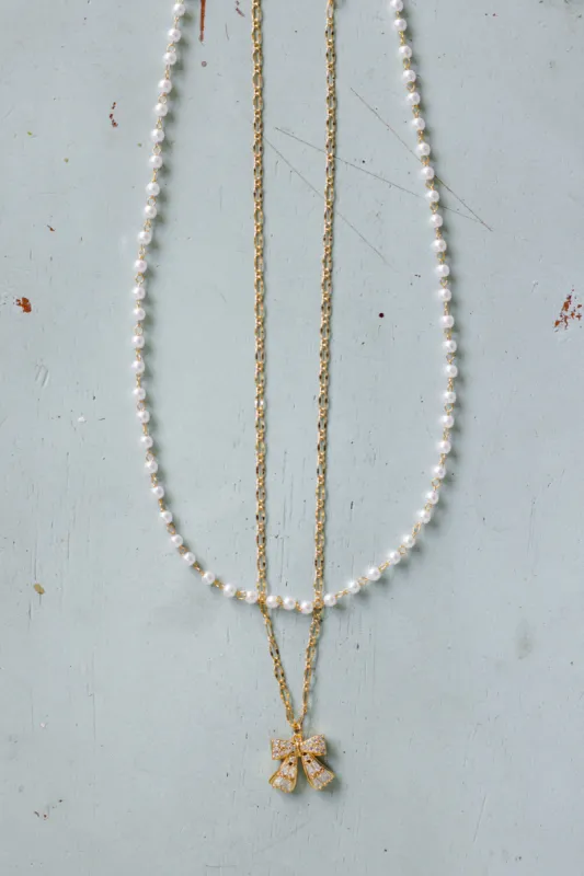 Bow Necklace in Gold | N7992G sold by Glik’s