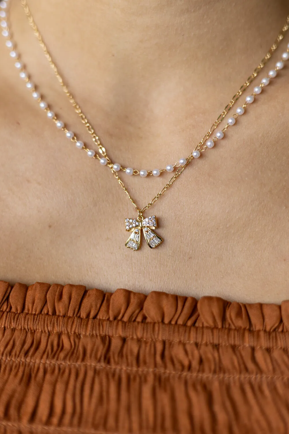 Bow Necklace in Gold | N7992G sold by Glik’s product image thumbnail 2