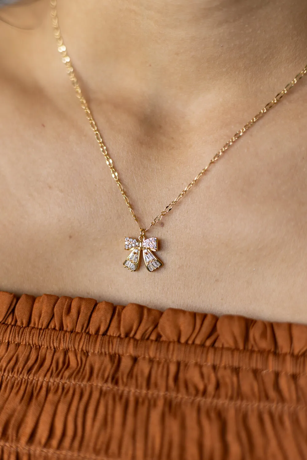 Bow Necklace in Gold | N7992G sold by Glik’s product image thumbnail 5