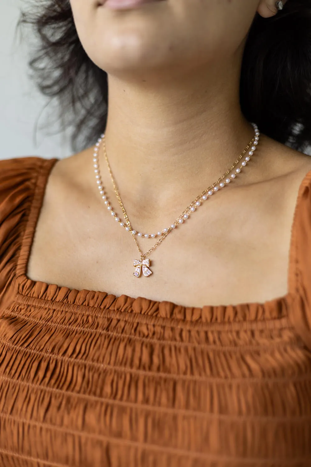 Bow Necklace in Gold | N7992G sold by Glik’s product image thumbnail 3