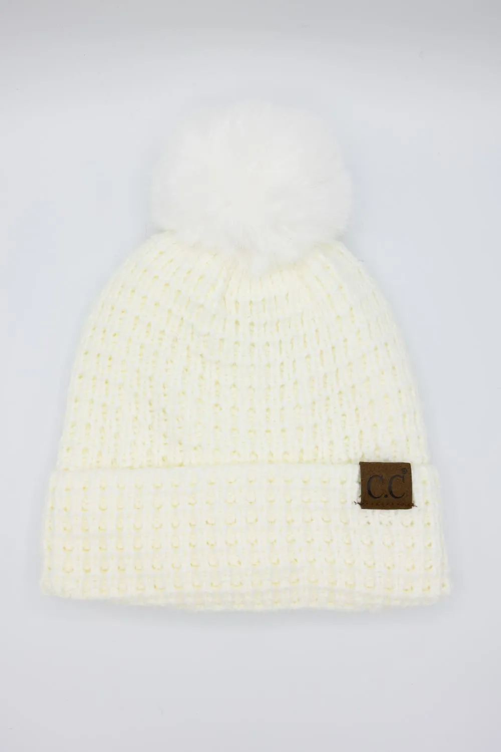 C.C. Waffle Knit Beanie with a Fur Pom for Women in Ivory | HTE0032-IVORY sold by Glik’s