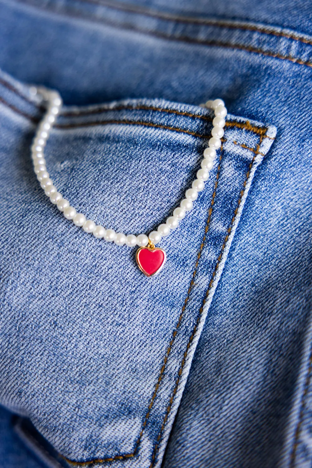 Pearl Chain Red Heart Charm Necklace in White | 199472-RDGD sold by Glik’s