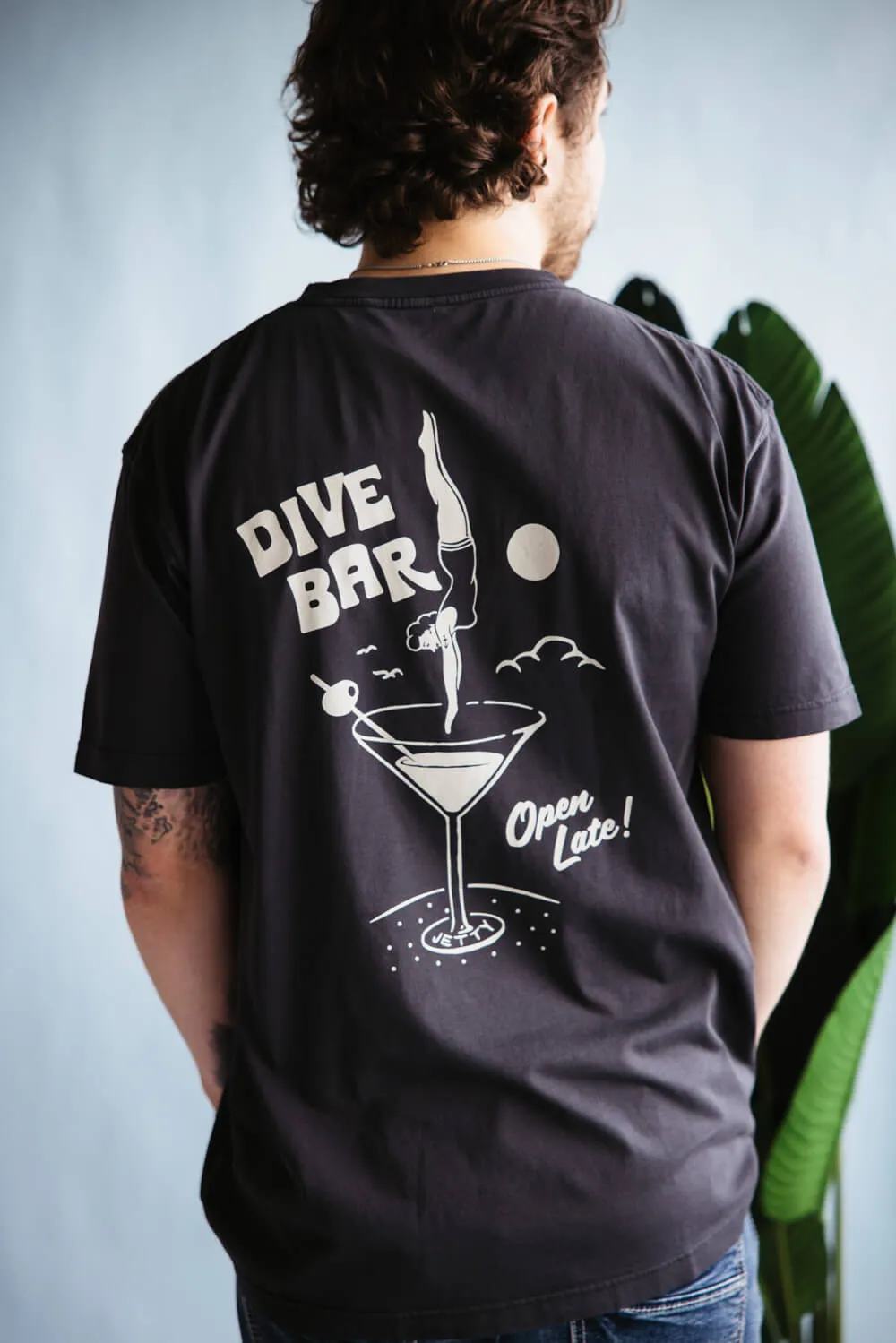 Jetty Dive Bar T-Shirt for Men in Black | S25DIVE-M10001BLK sold by Glik’s
