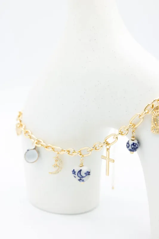 Cross Charm Necklace in Gold/Blue | NNA283GDBLE sold by Glik’s