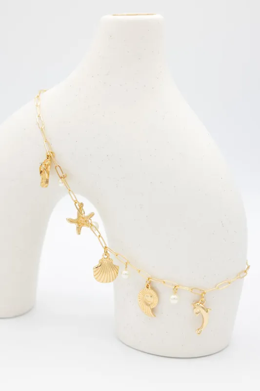 Sea Life Charm Necklace in Gold | JNC407GDCRM sold by Glik’s