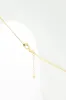 Cherry Charm Necklace in Gold | ONB866GDMRD sold by Glik’s