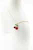 Cherry Charm Necklace in Gold | ONB866GDMRD sold by Glik’s