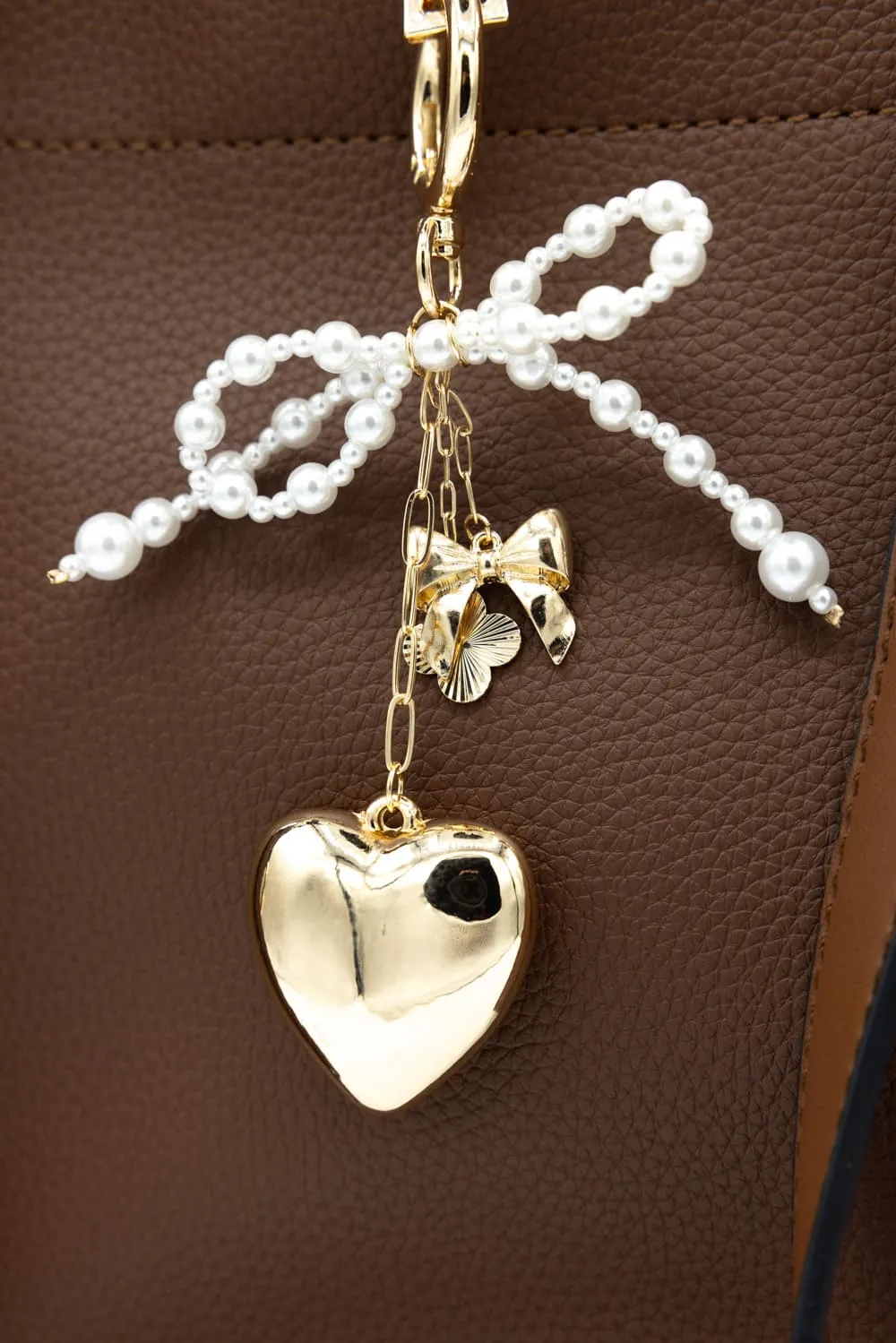 Pearl Bow Heart Purse Charm in Gold | NCA056-GDDRM sold by Glik’s product image thumbnail 3