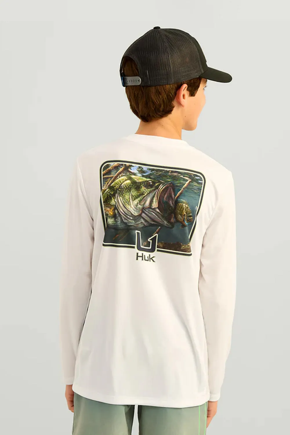 Huk Fishing Youth Graphic Pursuit Performance Shirt for Boys in White Bass | H7120122-100-WHITE sold by Glik’s