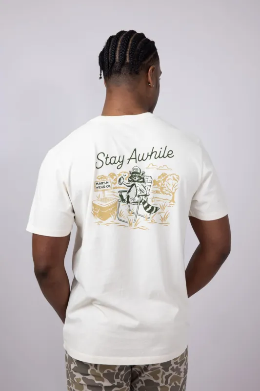 Marsh Wear Stay Awhile Raccoon T-Shirt for Men in White | MWT5018-VWHT sold by Glik’s