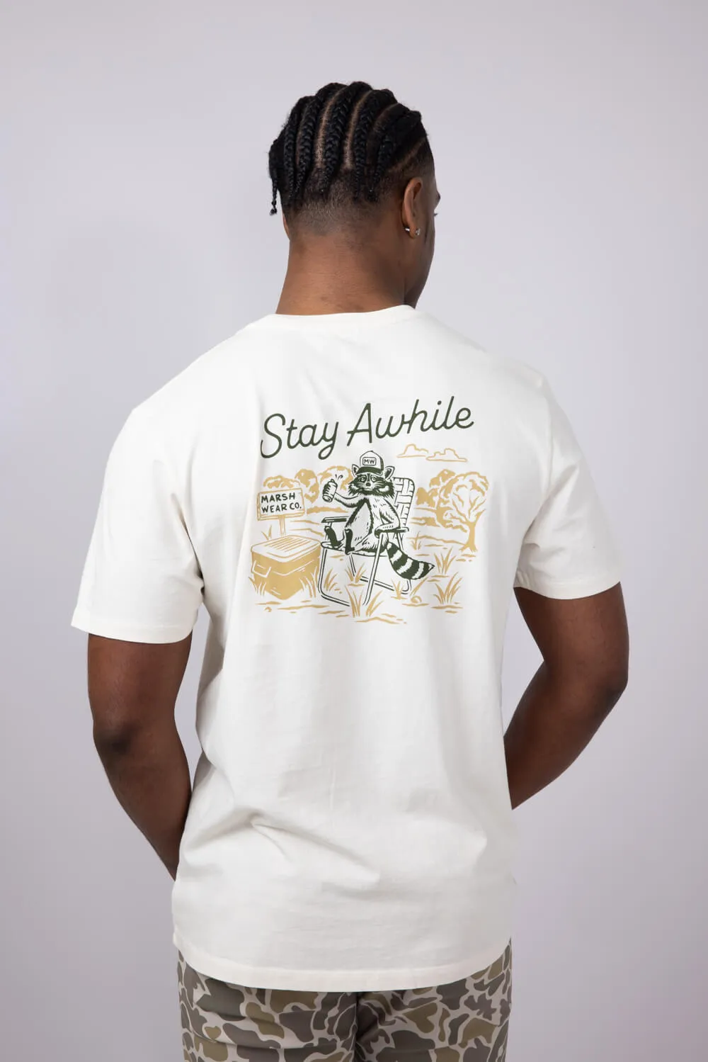 Marsh Wear Stay Awhile Raccoon T-Shirt for Men in White | MWT5018-VWHT sold by Glik’s