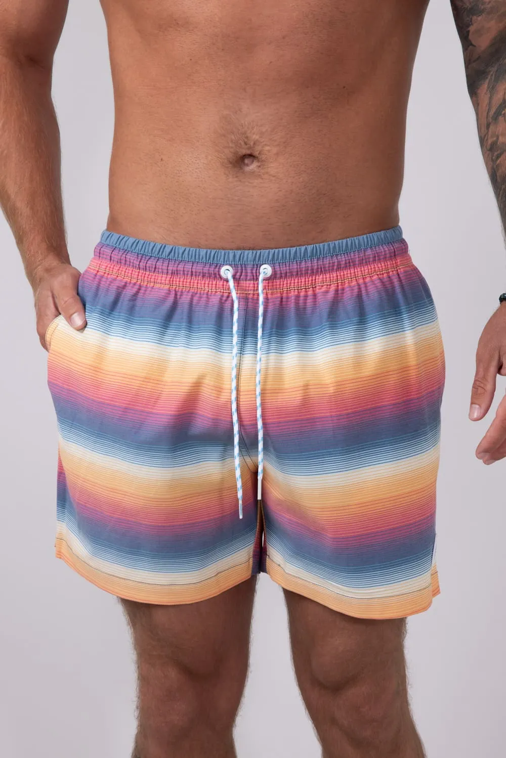 Chubbies Classic Lined Swim Trunks 5.5” Shorts for Men in Blue/Orange Gradient Stripe | 109241-104 sold by Glik’s