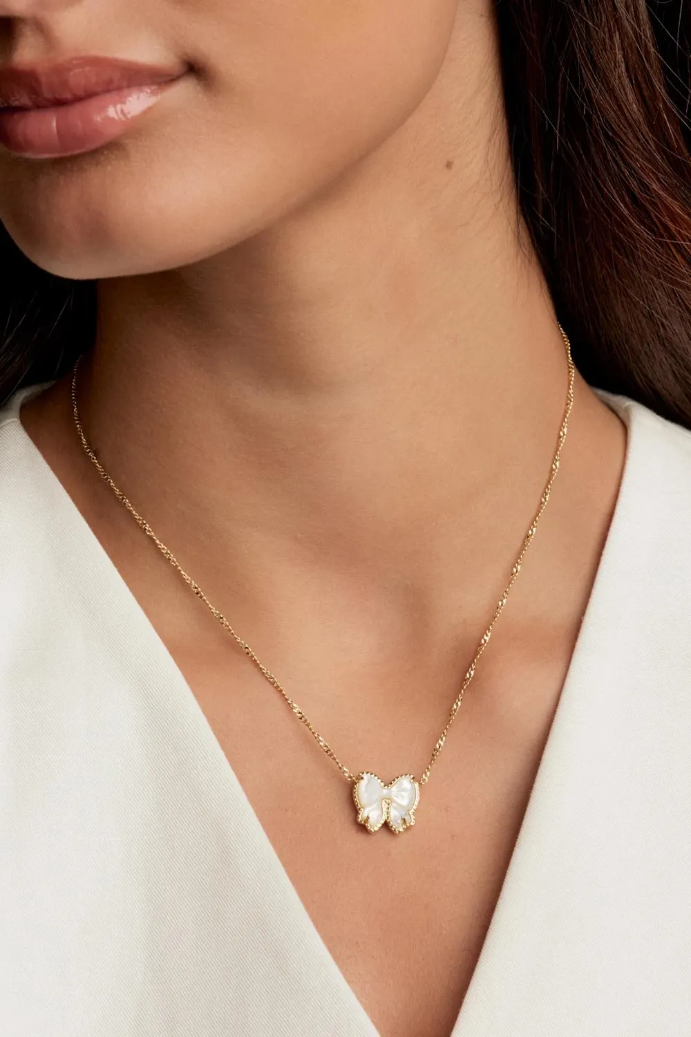 Kendra Scott Haley Bow Short Pendant Necklace in Gold | 9608886084 sold by Glik’s product image thumbnail 4