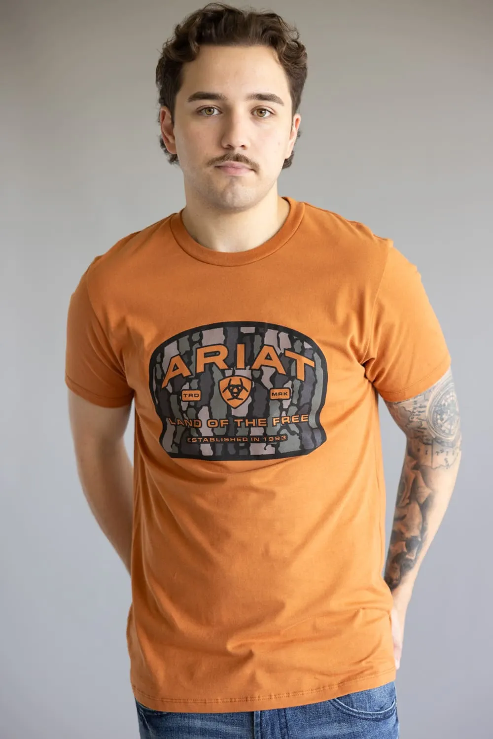Ariat Underlands Camo Badge T-Shirt for Men in Orange | 10062417-ADOBE sold by Glik’s