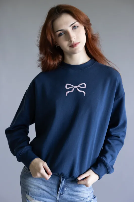 1897 Active Embroidered Center Bow Fleece Sweatshirt for Women in Indigo Blue | T1317-INDIGOBLUE sold by Glik’s